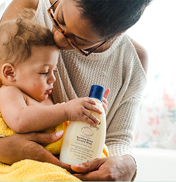 baby and mom with aveeno baby lotion